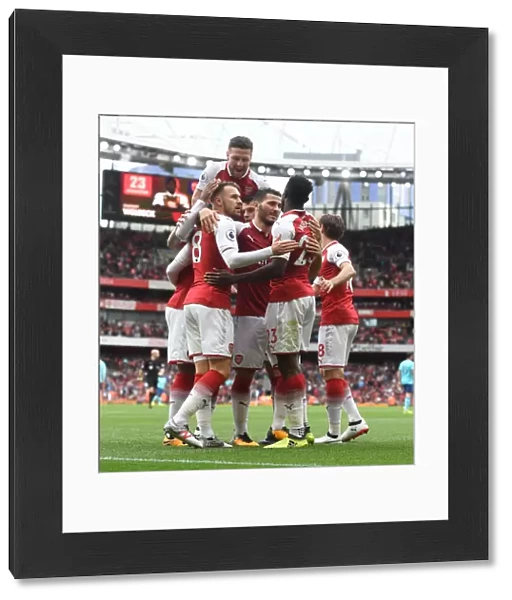 Arsenal's Danny Welbeck, Aaron Ramsey, Shkodran Mustafi, and Sead Kolasinac Celebrate Goals Against AFC Bournemouth