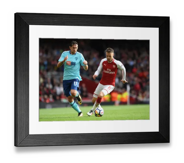 Framed Print : Arsenal's Aaron Ramsey Faces Off Against AFC Bournemouth's Charlie Daniels in Premier League Clash Framed Print : Arsenal's Aaron Ramsey Faces Off Against AFC Bournemouth's Charlie Daniels in Premier League Clash