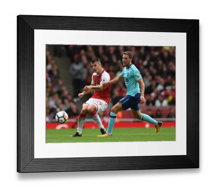 Framed Print : Xhaka vs. Gosling: Intense Battle in Arsenal v AFC Bournemouth Premier League Clash Framed Print : Xhaka vs. Gosling: Intense Battle in Arsenal v AFC Bournemouth Premier League Clash