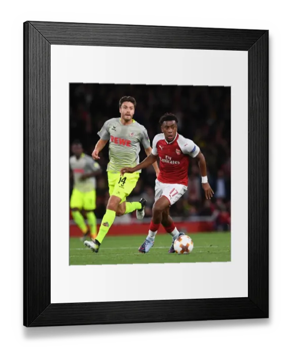 Framed Print : Arsenal's Alex Iwobi Clashes with Jonas Hector in Europa League Showdown