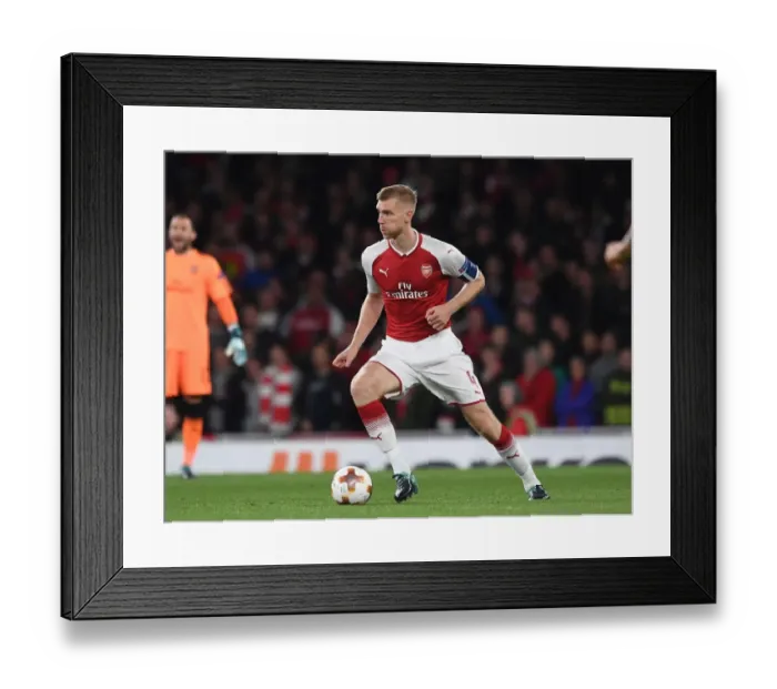 Framed Print : Per Mertesacker's Unwavering Concentration: Arsenal's Europa League Battle Against 1. FC Köln Framed Print : Per Mertesacker's Unwavering Concentration: Arsenal's Europa League Battle Against 1. FC Köln