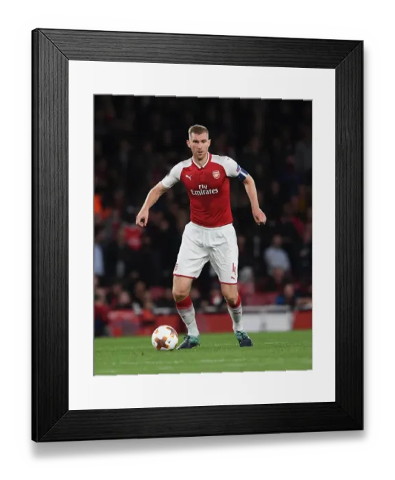 Framed Print : Per Mertesacker's Unwavering Concentration: Arsenal's Europa League Showdown Against 1. FC Köln Framed Print : Per Mertesacker's Unwavering Concentration: Arsenal's Europa League Showdown Against 1. FC Köln