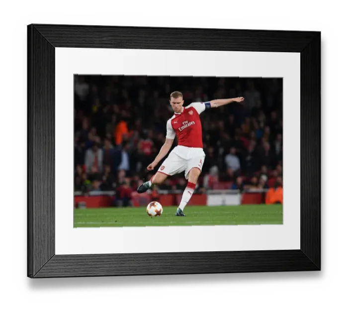 Framed Print : Per Mertesacker's Unwavering Concentration: Arsenal's Europa League Battle Against 1. FC Koeln