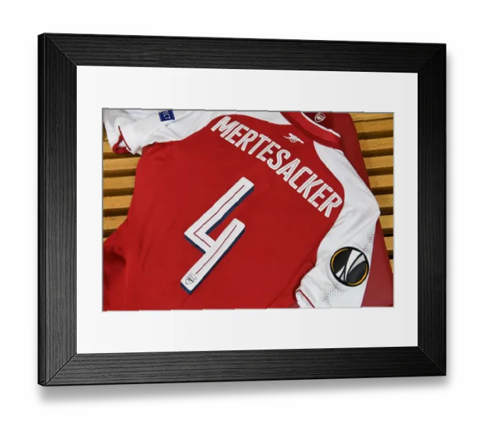 Framed Print : Per Mertesacker's Arsenal Shirt and Pennant in Arsenal Dressing Room (Arsenal v FC Köln, 2017-18)