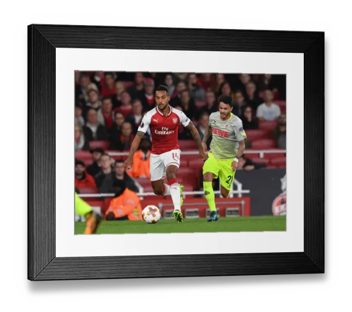 Framed Print : Walcott vs. Bittencourt: A Football Rivalry Erupts in the Arsenal vs. 1. FC Koeln UEFA Europa League Match