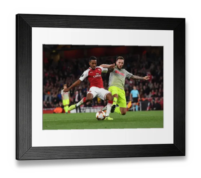 Framed Print : Theo Walcott vs Jorge Mere: Intense Moment in Arsenal v FC Köln UEFA Europa League Clash Framed Print : Theo Walcott vs Jorge Mere: Intense Moment in Arsenal v FC Köln UEFA Europa League Clash