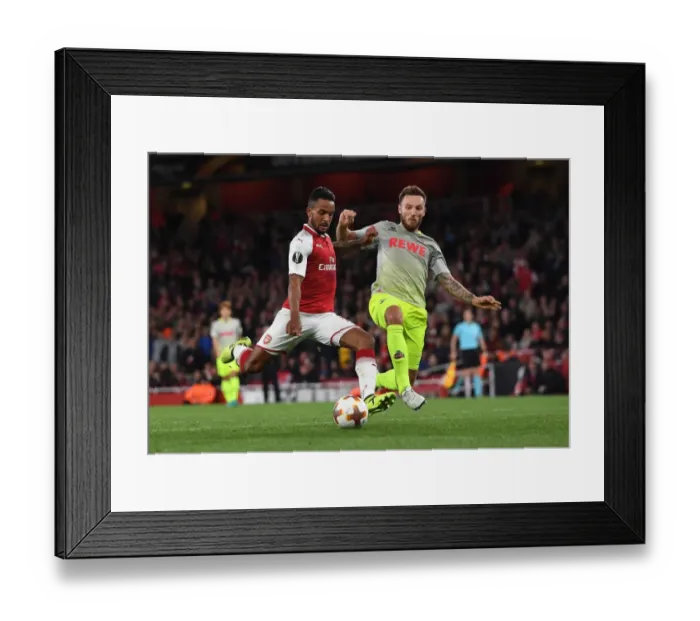 Framed Print : Theo Walcott vs Jorge Mere: A Tense Shooting Showdown in Arsenal FC vs 1. FC Koeln UEFA Europa League Match Framed Print : Theo Walcott vs Jorge Mere: A Tense Shooting Showdown in Arsenal FC vs 1. FC Koeln UEFA Europa League Match