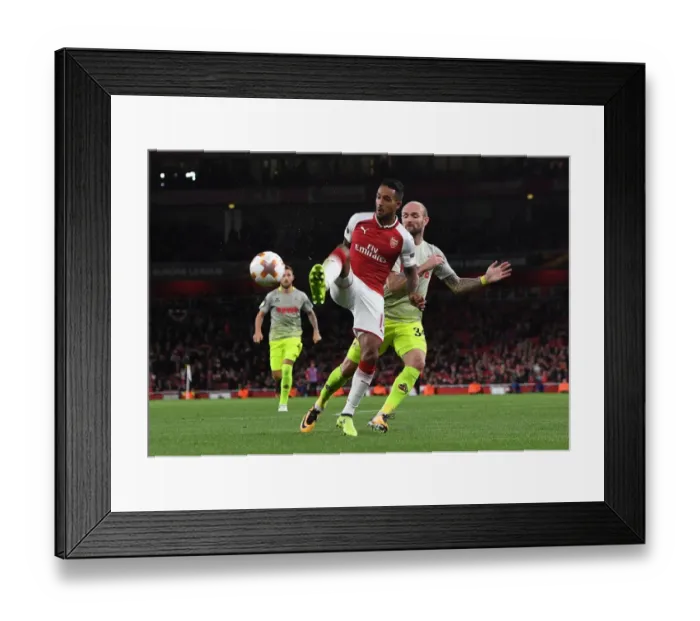 Framed Print : Theo Walcott vs. Konstantin Rausch: A Battle for Control in Arsenal v FC Köln UEFA Europa League Clash Framed Print : Theo Walcott vs. Konstantin Rausch: A Battle for Control in Arsenal v FC Köln UEFA Europa League Clash