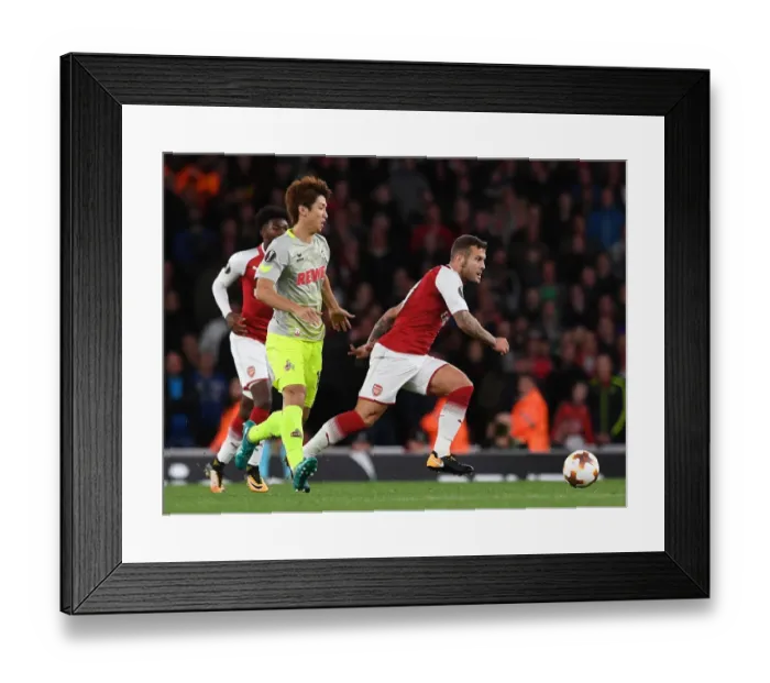 Framed Print : Arsenal's Jack Wilshere Clashes with FC Köln's Yuya Osako in Europa League Showdown Framed Print : Arsenal's Jack Wilshere Clashes with FC Köln's Yuya Osako in Europa League Showdown