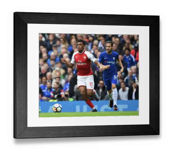 Framed Print : Arsenal's Alex Iwobi Outmaneuvers Chelsea's Cesc Fabregas in Premier League Clash Framed Print : Arsenal's Alex Iwobi Outmaneuvers Chelsea's Cesc Fabregas in Premier League Clash