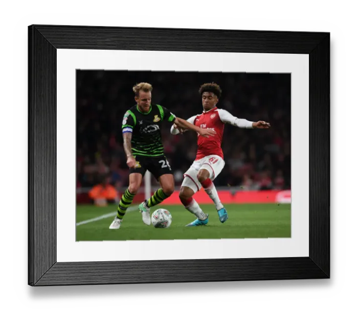 Framed Print : Reiss Nelson vs. James Coppinger: Arsenal vs. Doncaster Rovers in Carabao Cup Clash Framed Print : Reiss Nelson vs. James Coppinger: Arsenal vs. Doncaster Rovers in Carabao Cup Clash