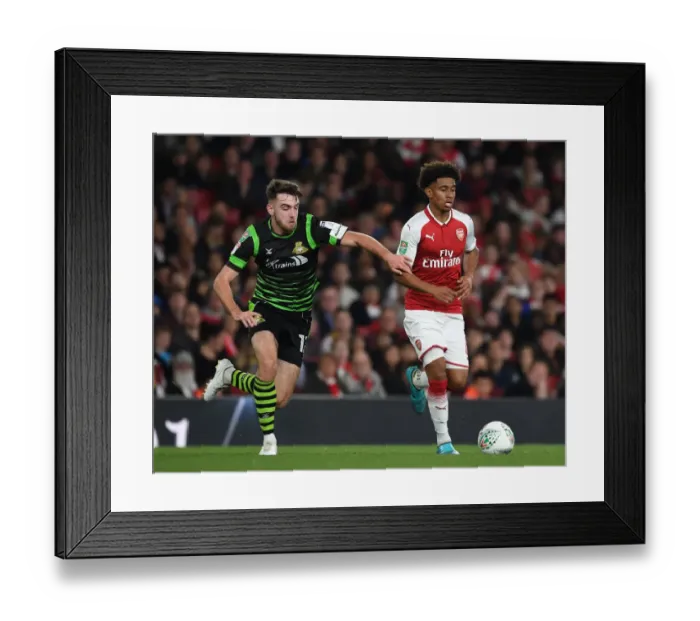 Framed Print : Reiss Nelson Outmaneuvers Ben Whiteman: Arsenal vs Doncaster Rovers, Carabao Cup 2017-18