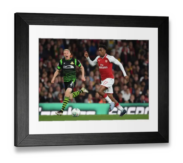 Framed Print : Alex Iwobi Outmaneuvers Craig Alcock in Arsenal's Carabao Cup Victory