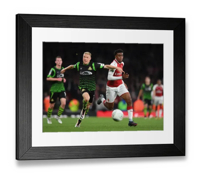Framed Print : Alex Iwobi vs. Craig Alcock: A Carabao Cup Battle at Arsenal's Emirates Stadium