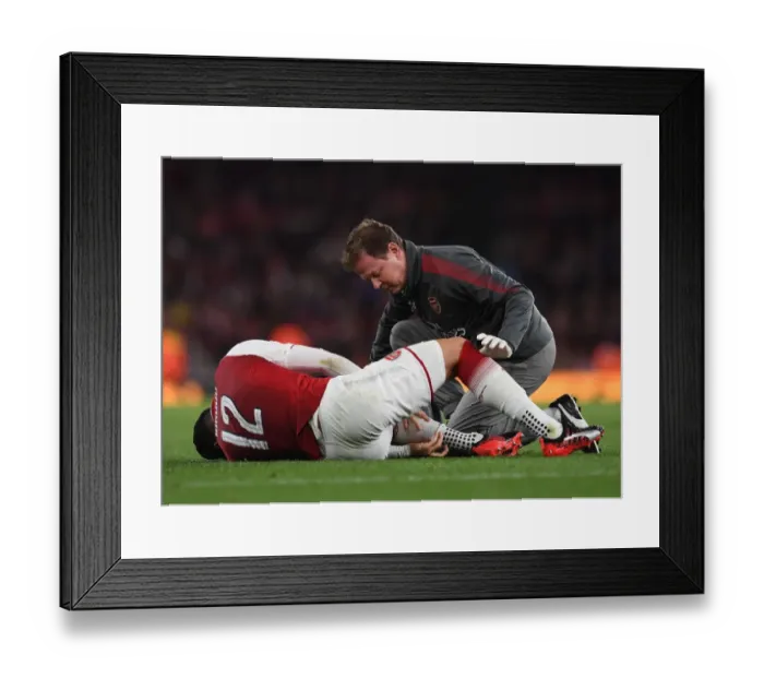 Framed Print : Arsenal's Colin Lewin Tends to Olivier Giroud during Match against Doncaster in Carabao Cup