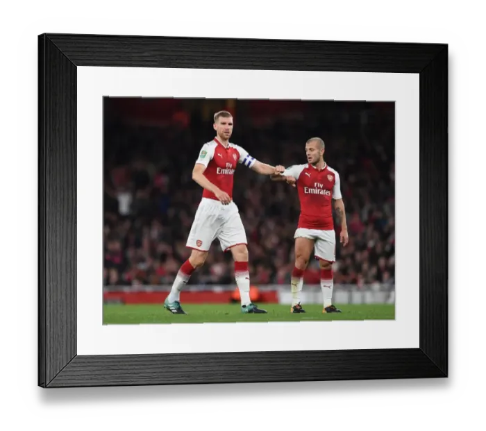 Framed Print : Arsenal's Jack Wilshere and Per Mertesacker in Action against Doncaster Rovers in Carabao Cup