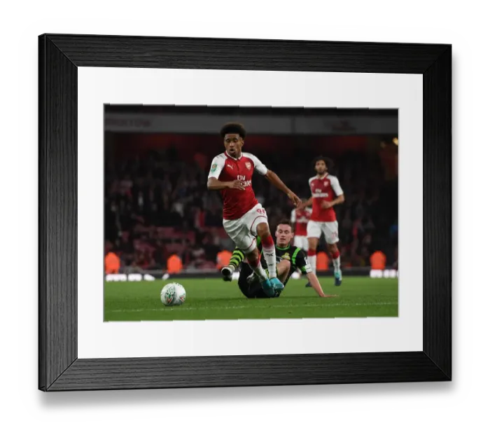 Framed Print : Reiss Nelson (Arsenal) Liam Mandeville (Doncaster) Framed Print : Reiss Nelson (Arsenal) Liam Mandeville (Doncaster)