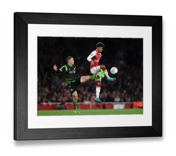 Framed Print : Reiss Nelson vs. Tommy Rowe: Arsenal's Young Star Shines Against Doncaster in Carabao Cup