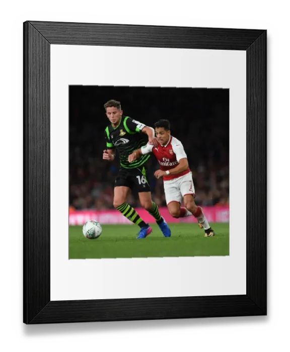 Framed Print : Clash of Champions: Sanchez vs. Houghton in Arsenal's Carabao Cup Battle Framed Print : Clash of Champions: Sanchez vs. Houghton in Arsenal's Carabao Cup Battle