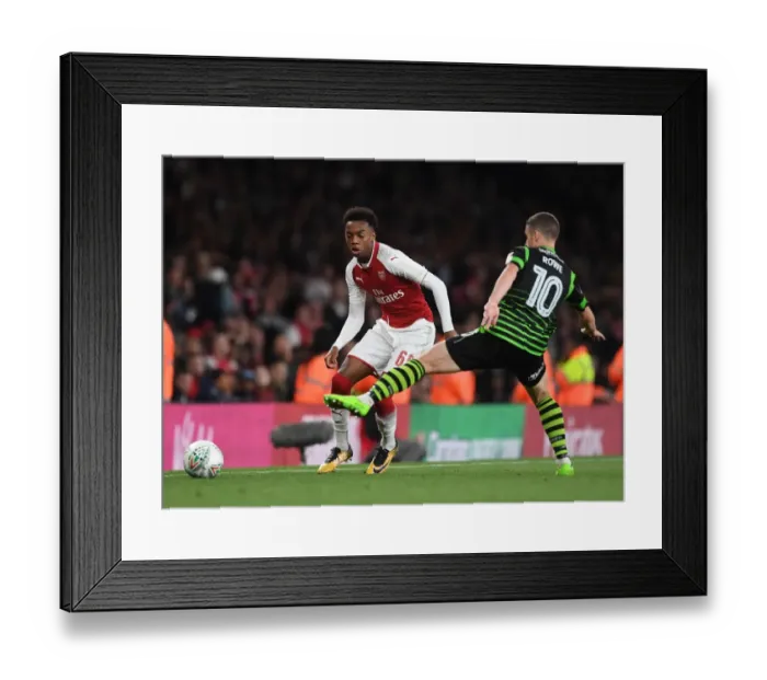 Framed Print : Joe Willock vs. Tommy Rowe: Intense Battle in Arsenal's Carabao Cup Clash Against Doncaster