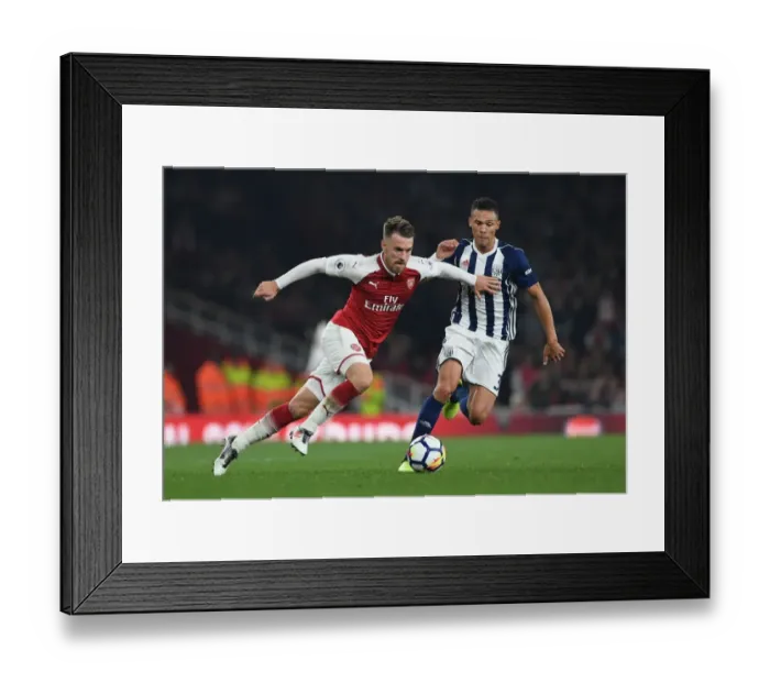 Framed Print : Arsenal's Aaron Ramsey Fends Off Kieran Gibbs in Intense Clash with West Bromwich Albion Framed Print : Arsenal's Aaron Ramsey Fends Off Kieran Gibbs in Intense Clash with West Bromwich Albion