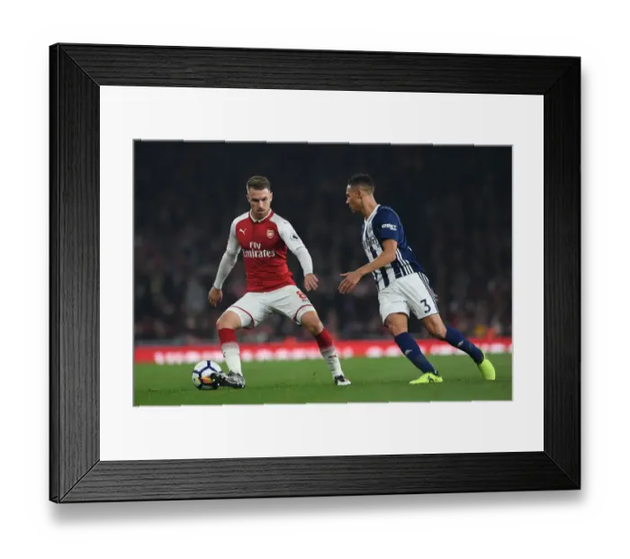 Framed Print : Ramsey vs. Gibbs: A Rivalry Ignites on the Arsenal Field