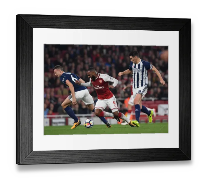 Framed Print : Arsenal's Lacazette Tripped by Evans and Barry in Premier League Clash vs. West Bromwich Albion Framed Print : Arsenal's Lacazette Tripped by Evans and Barry in Premier League Clash vs. West Bromwich Albion