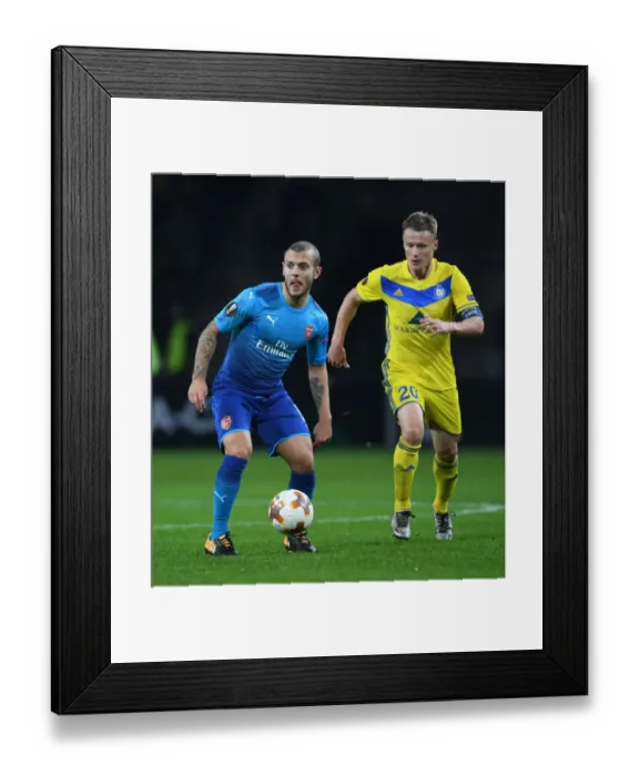 Framed Print : Jack Wilshere vs Vitali Rodionov: Battle in the Europa League between Arsenal and BATE Borisov