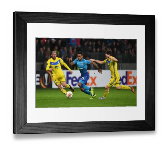 Framed Print : Theo Walcott Stands Firm Against Stasevich and Dragun: Arsenal's Europa League Showdown vs. FC BATE Borisov Framed Print : Theo Walcott Stands Firm Against Stasevich and Dragun: Arsenal's Europa League Showdown vs. FC BATE Borisov