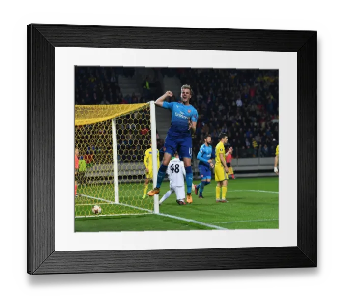 Framed Print : Rob Holding Scores as Arsenal Crush BATE Borisov in Europa League Framed Print : Rob Holding Scores as Arsenal Crush BATE Borisov in Europa League