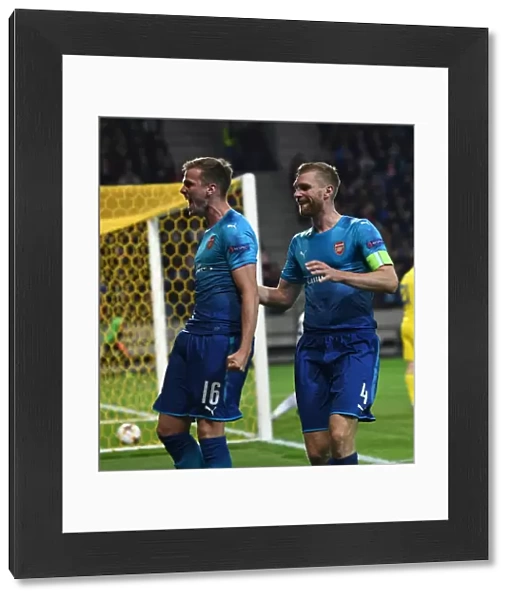 Arsenal's Rob Holding and Per Mertesacker Celebrate Goals in UEFA Europa League Match