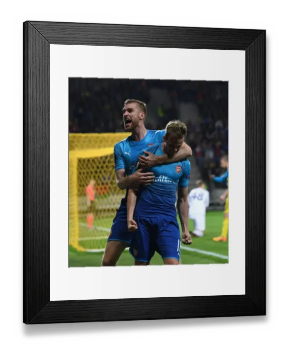Framed Print : Arsenal's Holding and Mertesacker Celebrate Goal in Europa League Against FC BATE Borisov Framed Print : Arsenal's Holding and Mertesacker Celebrate Goal in Europa League Against FC BATE Borisov