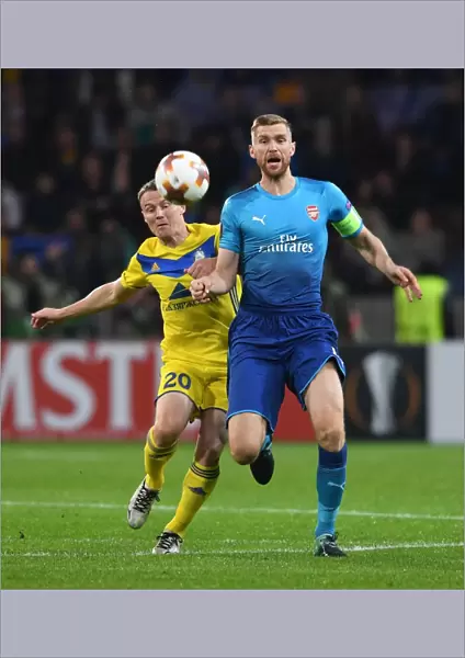 Per Mertesacker vs. Vitali Rodionov: A Battle in the UEFA Europa League between Arsenal FC and BATE Borisov