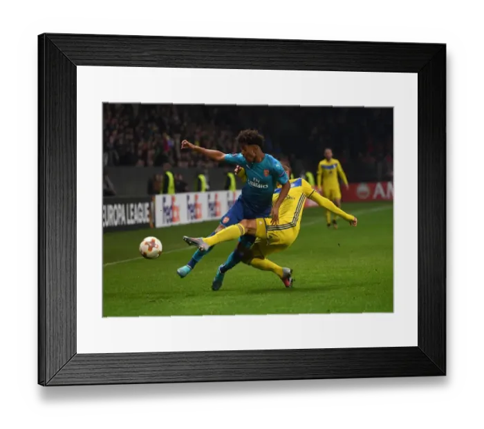 Framed Print : Reiss Nelson vs Maksim Volodko: A Battle in the Europa League between Arsenal FC and BATE Borisov Framed Print : Reiss Nelson vs Maksim Volodko: A Battle in the Europa League between Arsenal FC and BATE Borisov