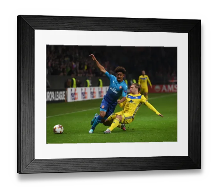 Framed Print : Reiss Nelson vs Maksim Volodko: A Europa League Showdown - Arsenal FC vs BATE Borisov