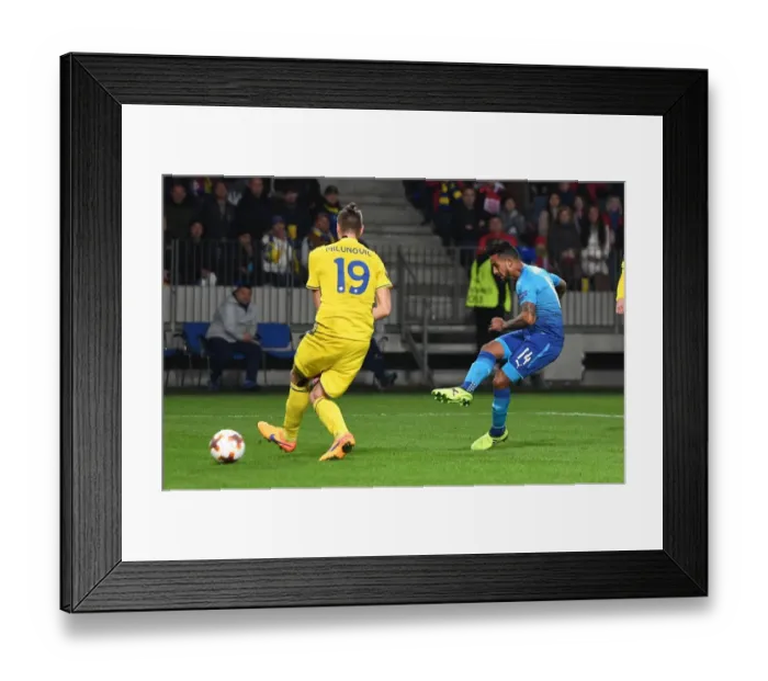 Framed Print : Theo Walcott Scores Against Igor Stasevich: Arsenal's Victory over BATE Borisov in Europa League Framed Print : Theo Walcott Scores Against Igor Stasevich: Arsenal's Victory over BATE Borisov in Europa League