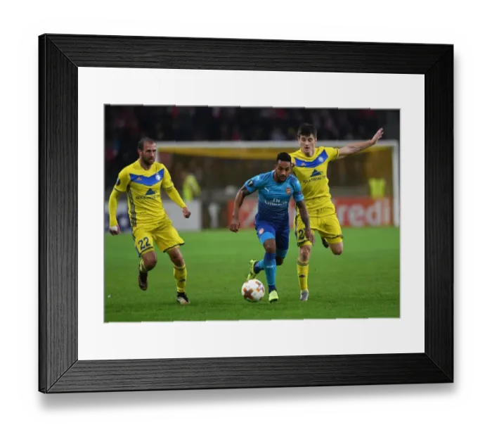 Framed Print : Theo Walcott Clashes with Stanislav Dragun and Igor Stasevich in Arsenal's UEFA Europa League Match against BATE Borisov Framed Print : Theo Walcott Clashes with Stanislav Dragun and Igor Stasevich in Arsenal's UEFA Europa League Match against BATE Borisov