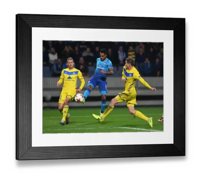 Framed Print : Theo Walcott Faces Off Against Volodko and Gaiduchik in Arsenal's UEFA Europa League Clash vs. BATE Borisov