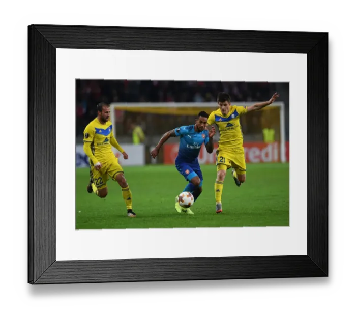 Framed Print : Theo Walcott vs. Stanislav Dragun and Igor Stasevich: Intense Face-Off in Arsenal-BATE Europa League Clash Framed Print : Theo Walcott vs. Stanislav Dragun and Igor Stasevich: Intense Face-Off in Arsenal-BATE Europa League Clash