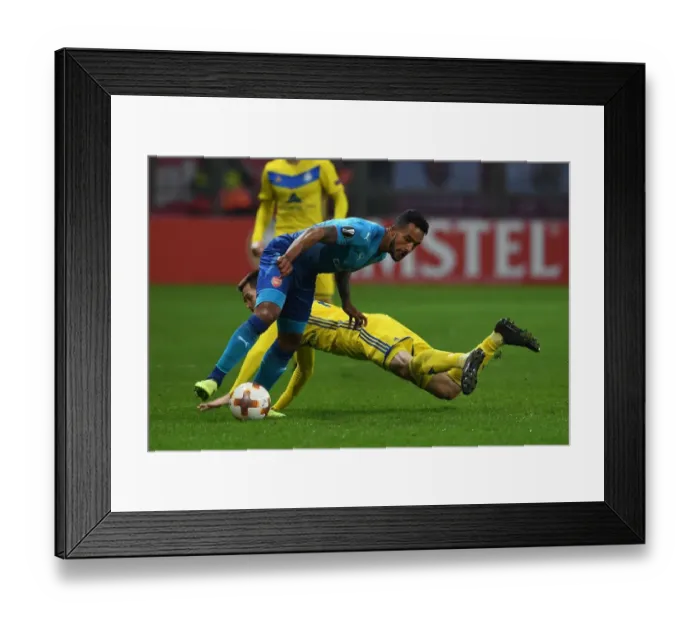 Framed Print : Theo Walcott vs. Mirko Ivanic: A Battle in the Europa League between Arsenal and BATE Borisov