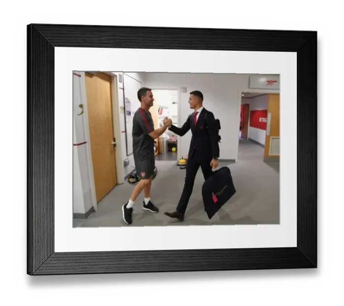 Framed Print : Arsenal: Granit Xhaka and Fitness Coach Shad Forsythe in the Home Changing Room before Arsenal v Brighton & Hove Albion, Premier League