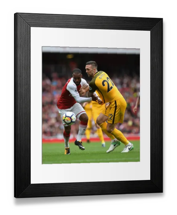 Framed Print : Arsenal's Lacazette Clashes with Brighton's Duffy in Premier League Showdown