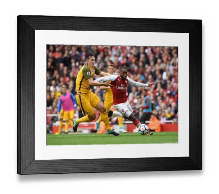 Framed Print : Arsenal's Alexandre Lacazette Clashes with Brighton's Lewis Dunk in Premier League Showdown