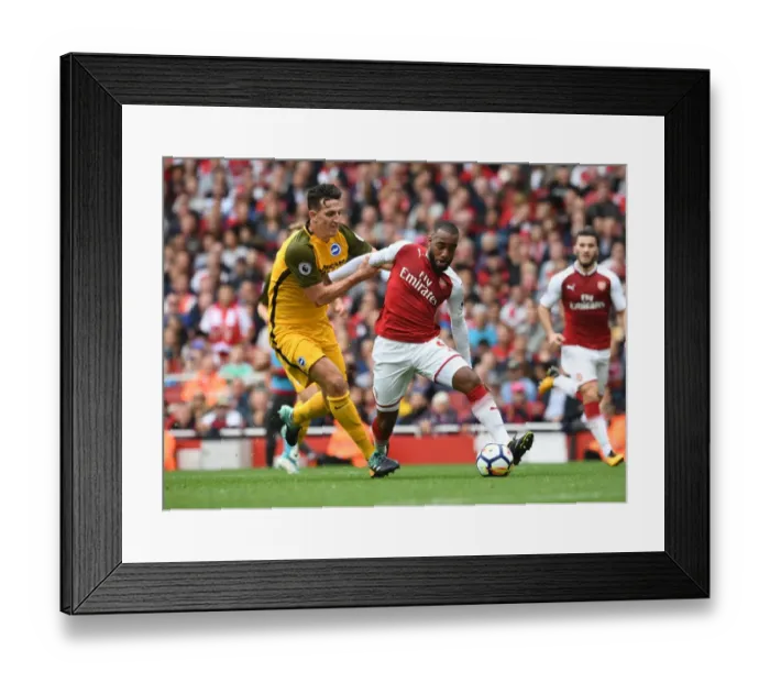 Framed Print : Clash of Titans: Lacazette vs. Dunk in Intense Arsenal vs. Brighton Premier League Showdown