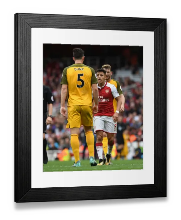 Framed Print : Arsenal's Alexis Sanchez and Lewis Dunk Clash During Premier League Match vs Brighton