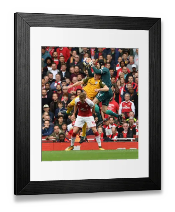 Framed Print : Arsenal's Petr Cech Clashes with Brighton's Shane Duffy in Premier League Showdown