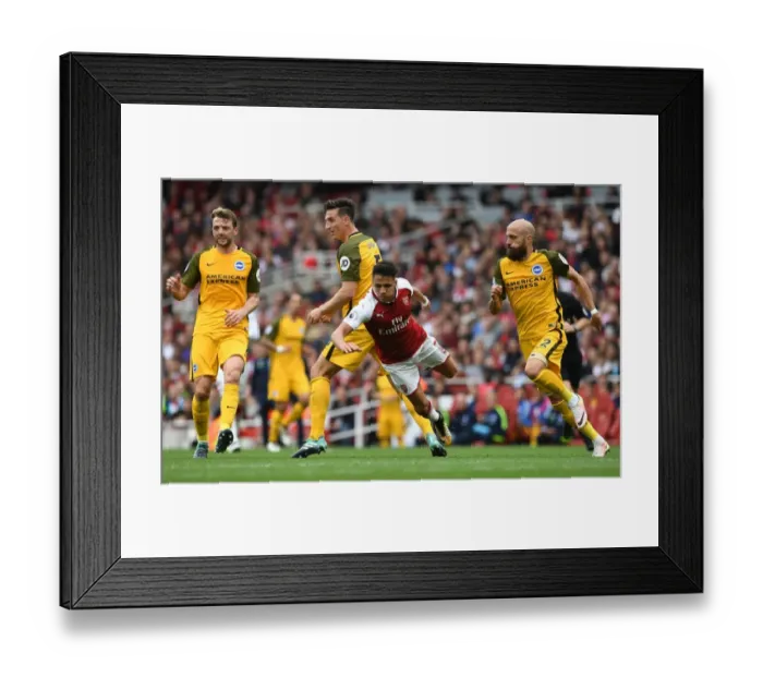 Framed Print : Arsenal's Alexis Sanchez Fouls by Brighton's Lewis Dunk in Premier League Clash Framed Print : Arsenal's Alexis Sanchez Fouls by Brighton's Lewis Dunk in Premier League Clash