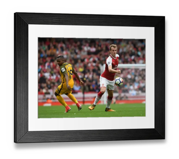 Framed Print : Arsenal's Rob Holding Battles Jose Izquierdo in Premier League Clash Framed Print : Arsenal's Rob Holding Battles Jose Izquierdo in Premier League Clash