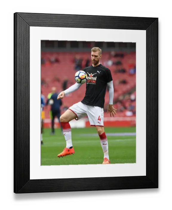 Framed Print : Arsenal's Per Mertesacker Secures 2-0 Victory Over Brighton in Premier League