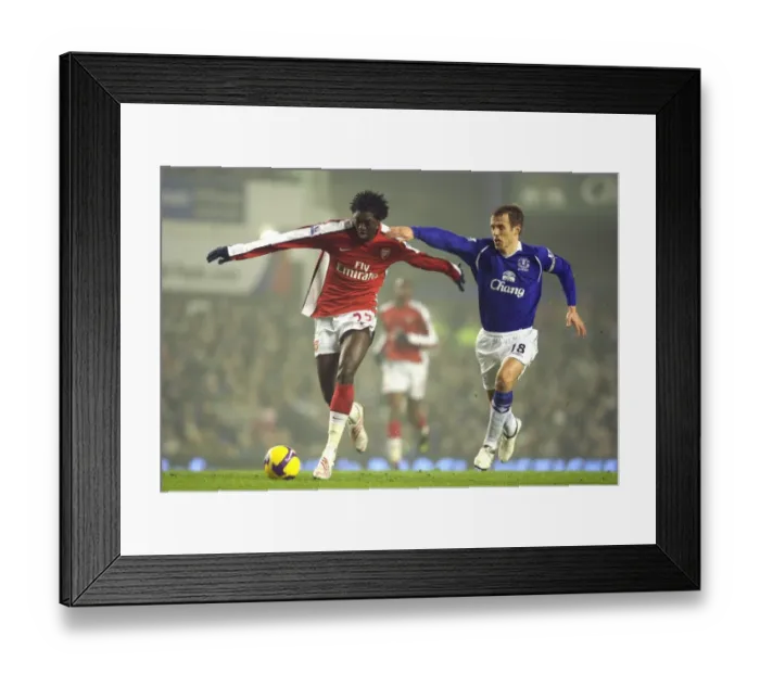 Framed Print : Adebayor vs. Neville: The Intense Rivalry at Goodison Park, January 2009 (1:1 Arsenal vs. Everton)